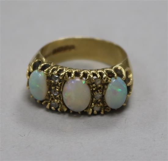 An 18ct gold, white opal and diamond set ring, size P.
